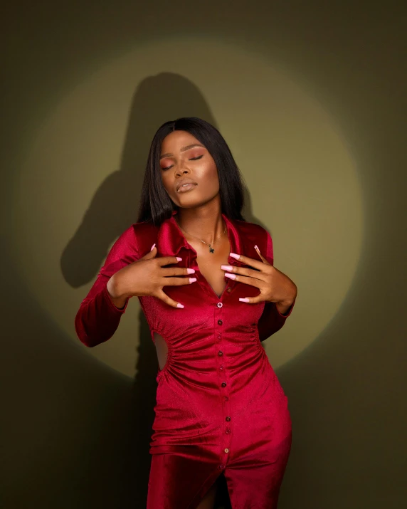 an african american woman posing in a red outfit