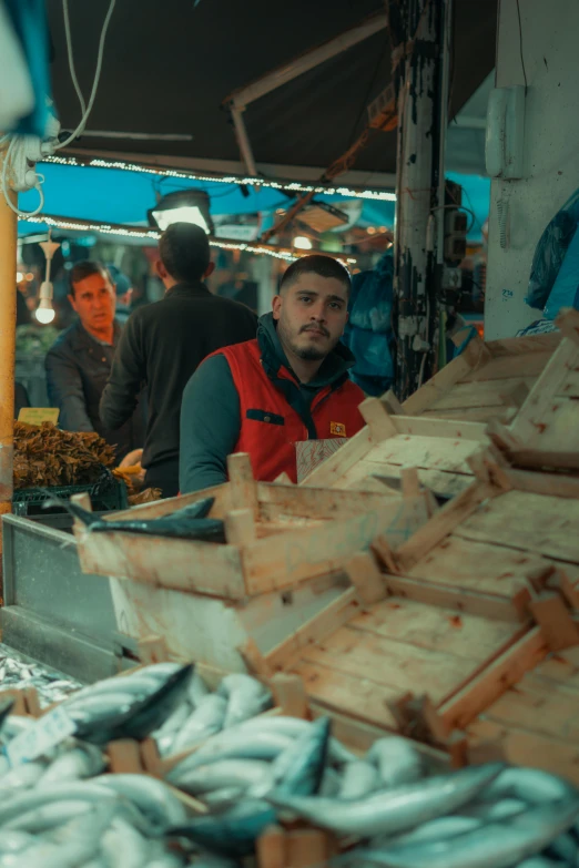 some people at the market and several food items