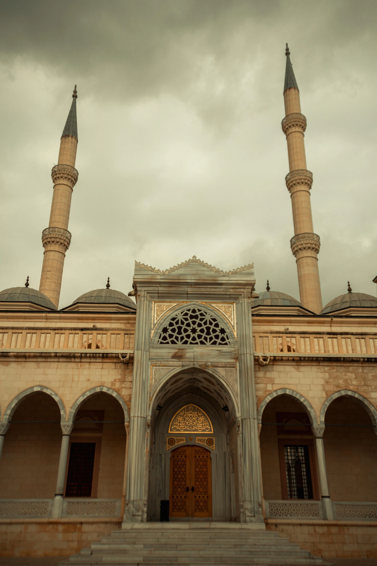 the large building has a few pillars and a door