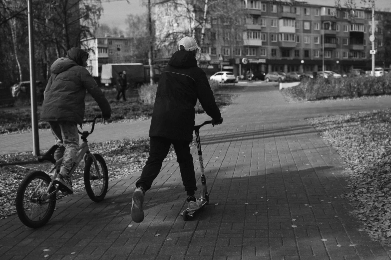 a person riding a bike with a person on the back