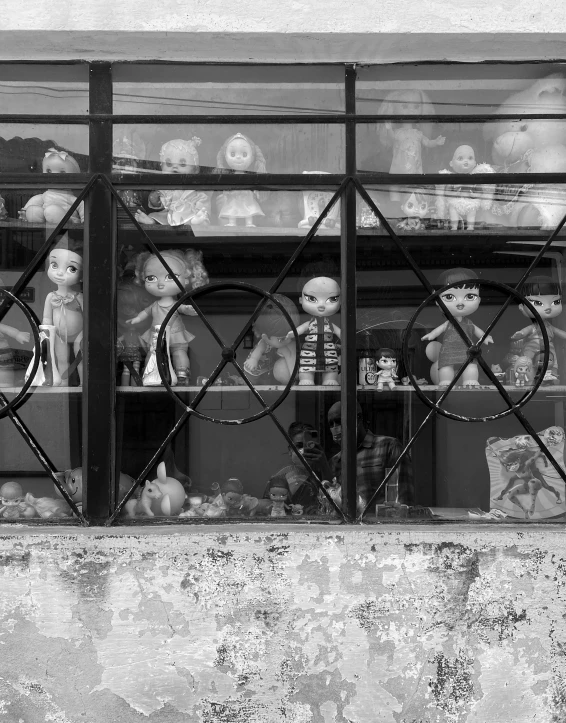 a window with many toy items in a display