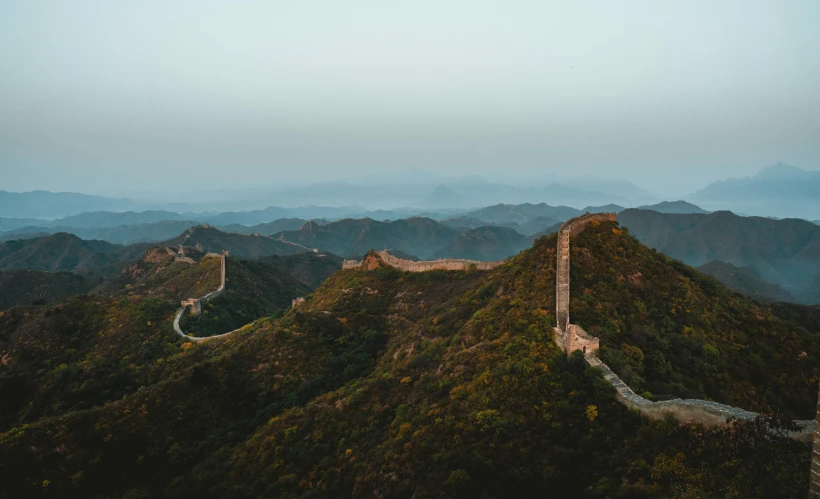 an image of great wall on the top of a mountain