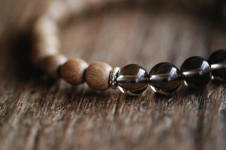 a close up view of beads with beaded chain