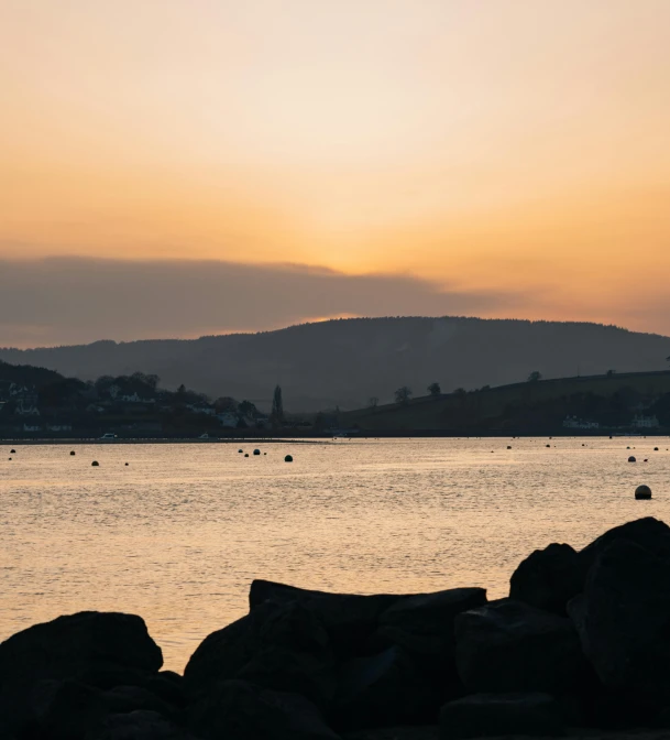 there is a water view of the ocean during sunset