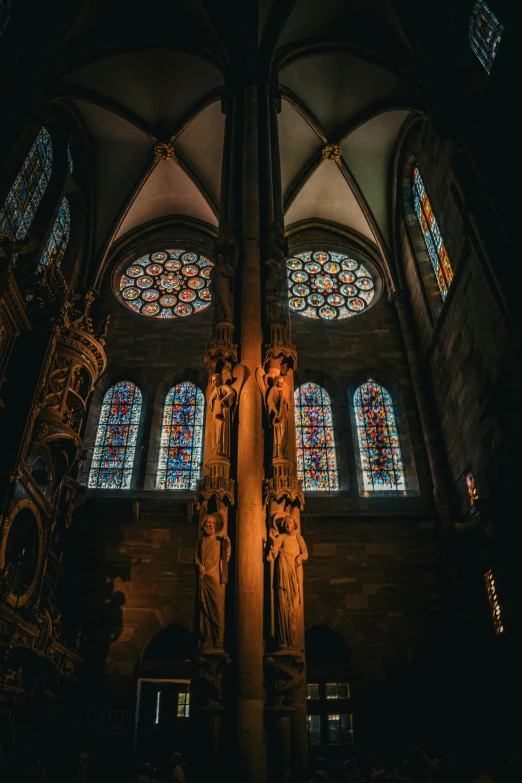 the alter of a large cathedral with some colorful windows