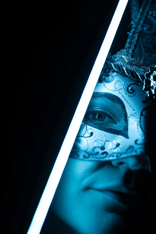 a dark po of a woman with her face painted as a skull