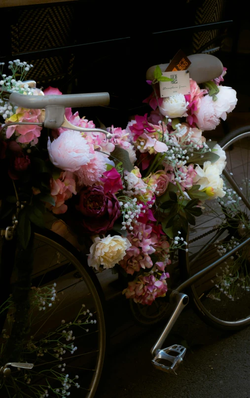 flowers and candles on the back of a bicycle