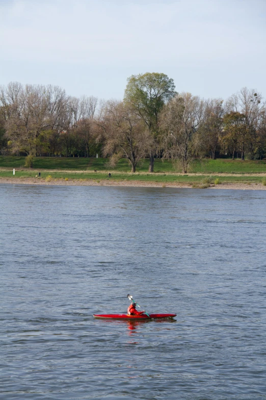 the person is in a red boat on the water