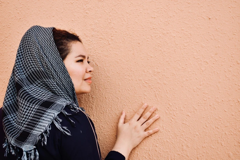 woman in an old style scarf is smiling