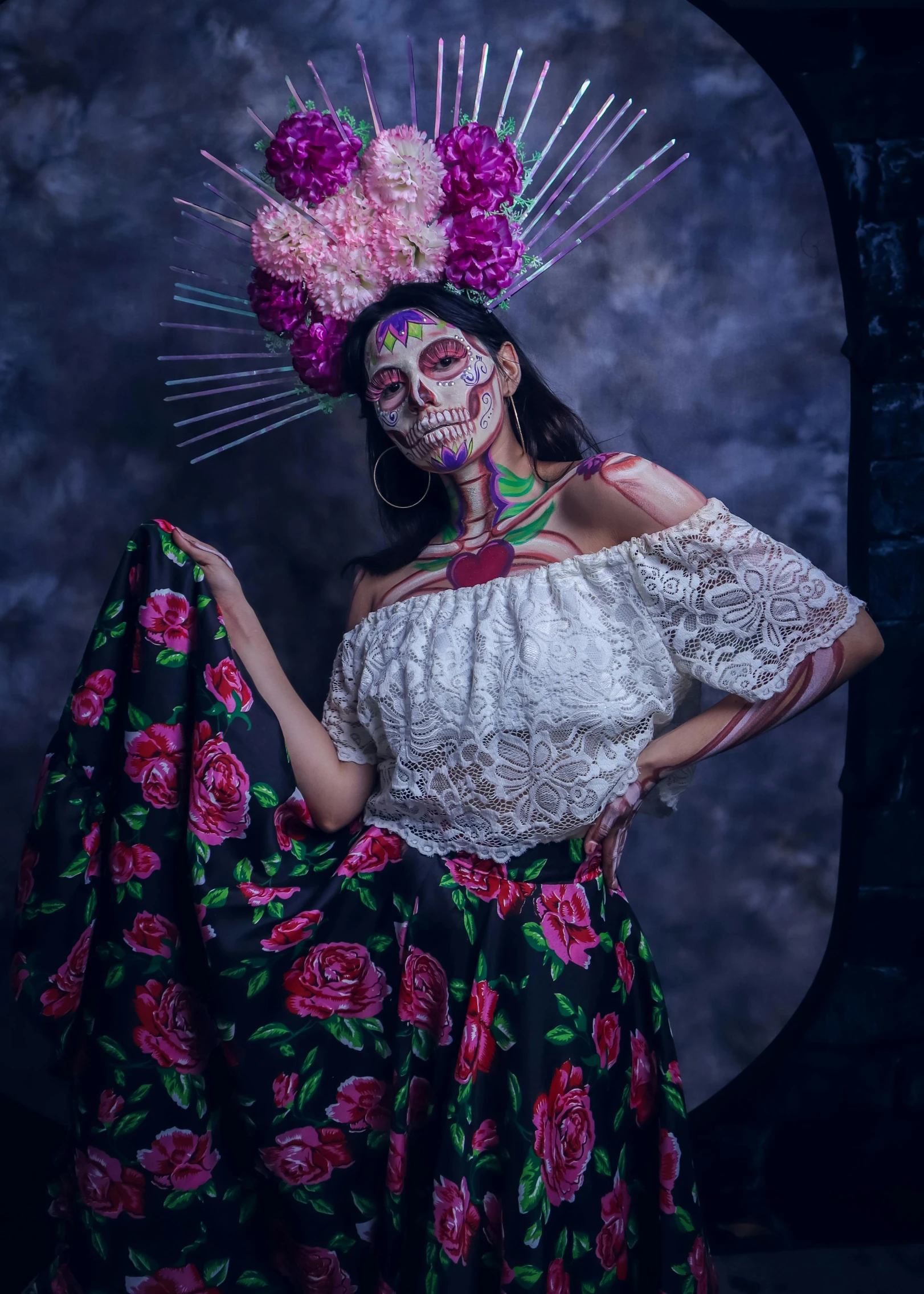 a woman in costume holds a garment on her head