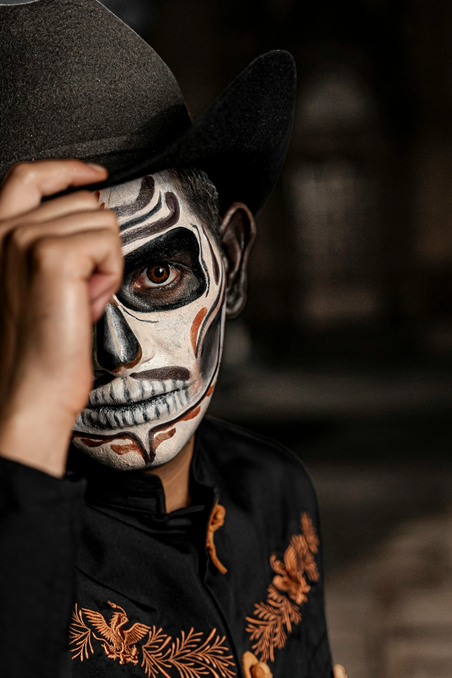 a man wearing mexican art make - up as a day of the dead