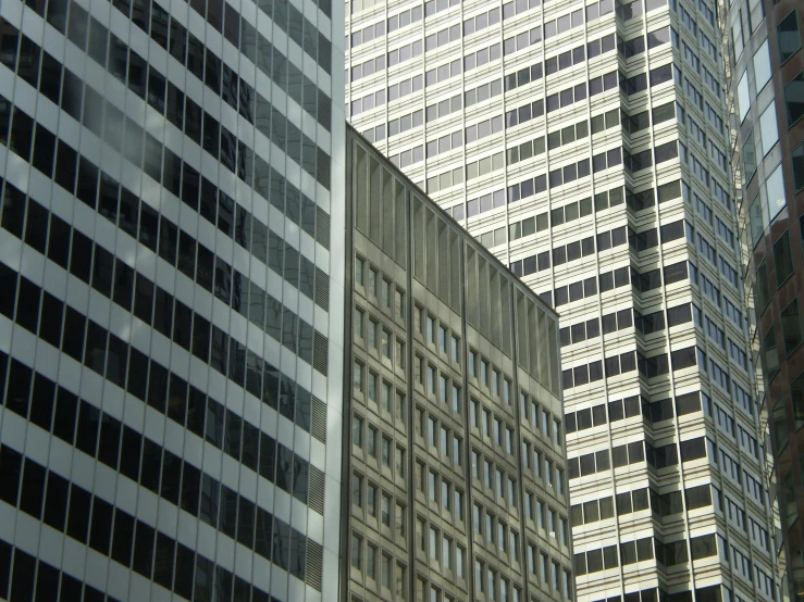 a couple of buildings are shown looking up at the sky