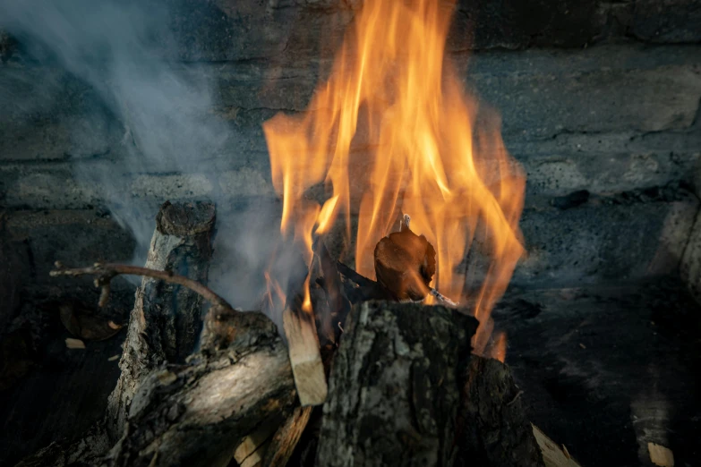 a bonfire that is blazing in the dark