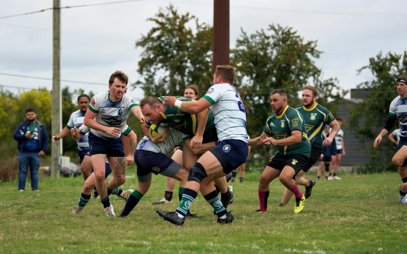 the game of rugby is on as the opposing teams face off