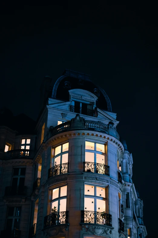 a building is lit up with lights all over