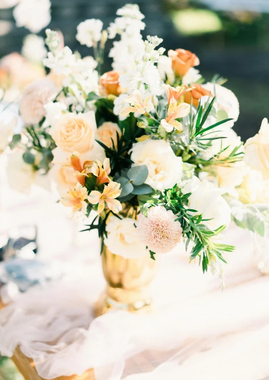 a flower vase is filled with yellow flowers