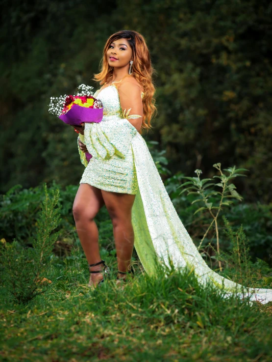 a woman in a white dress with flower bouquet