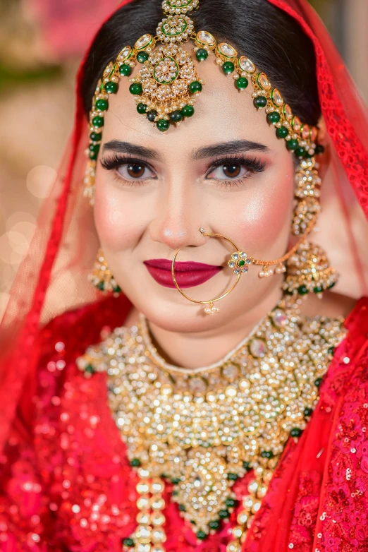 a beautiful woman in red poses for a po