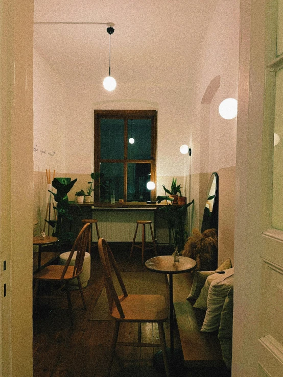 a room filled with furniture and lighting on the ceiling