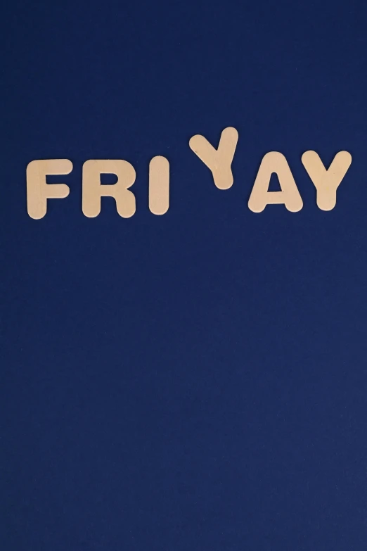 the word fri ya spelled out in small wooden letters on a dark blue background