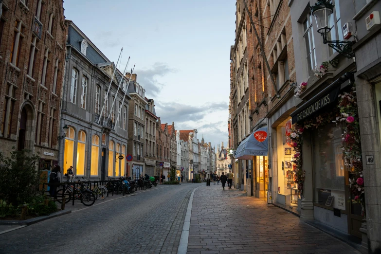 a view of the side of a row of old buildings and shops