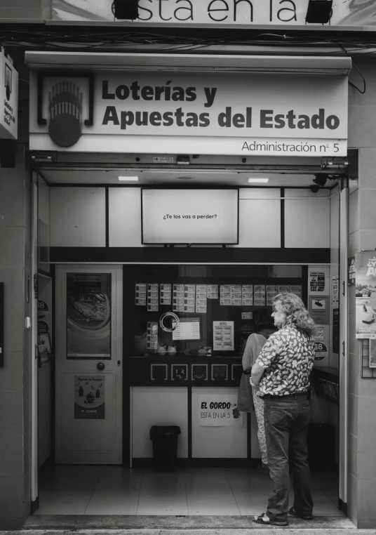 a woman standing at the entrance of a building