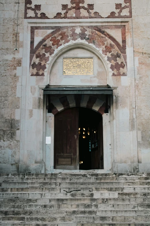 two doors open onto some steps near a building