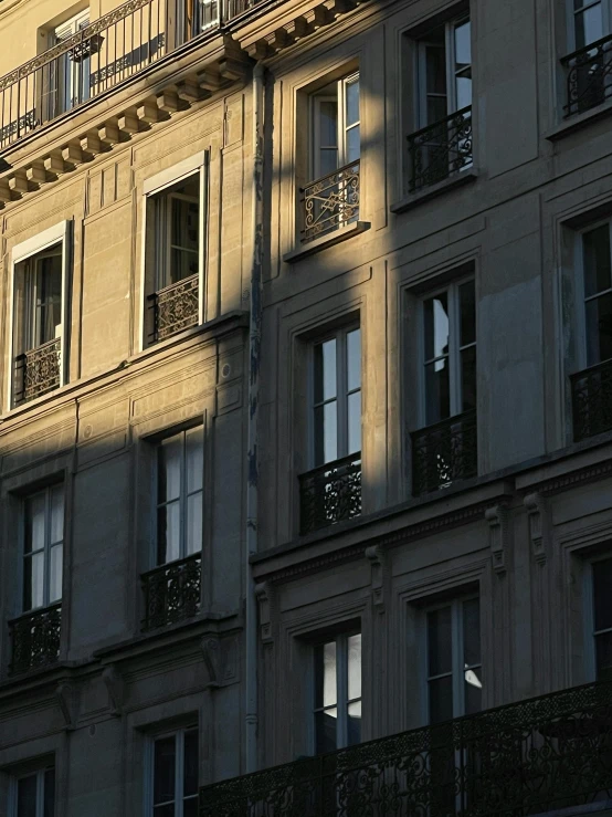 a very tall building with several balconies on each level