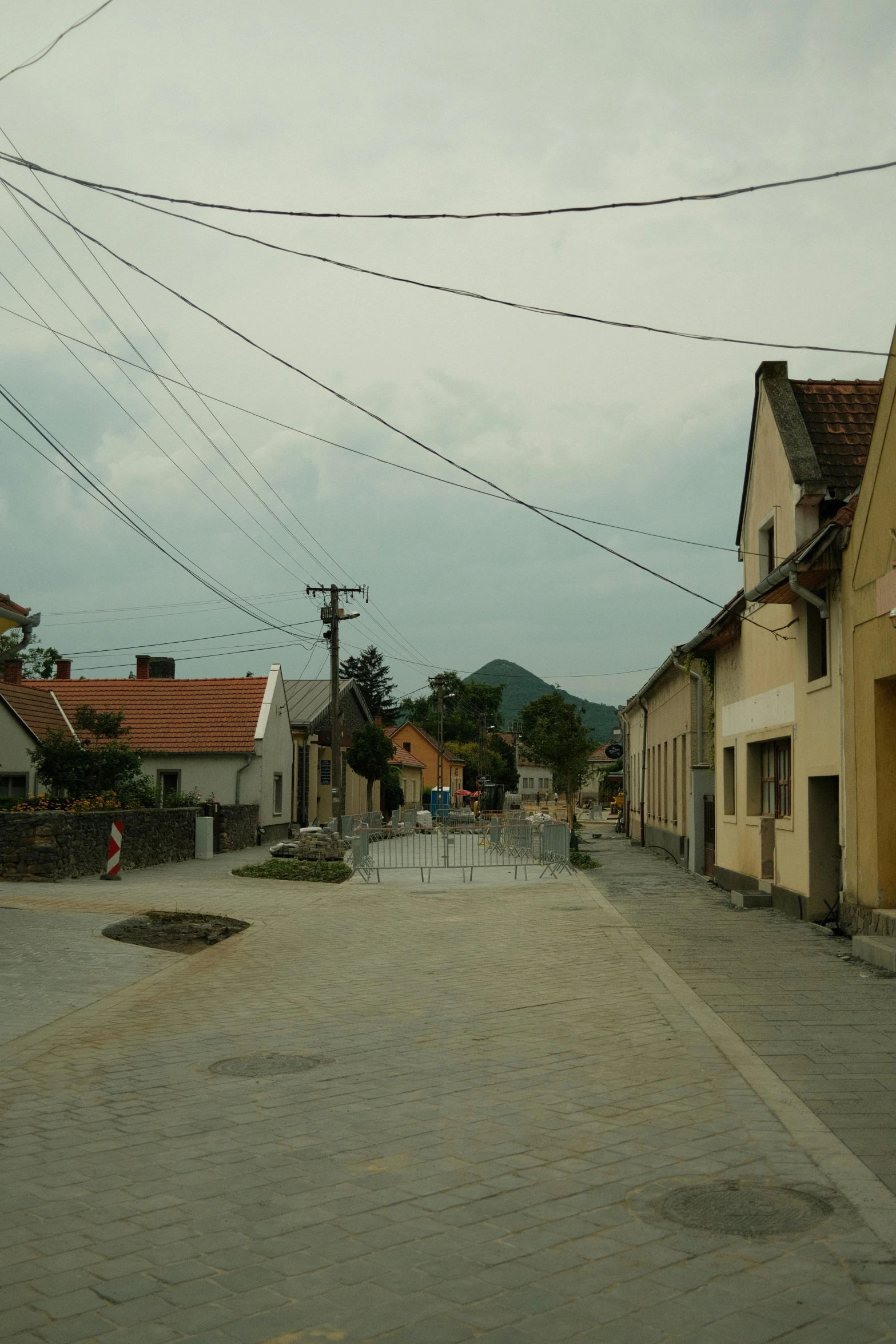 this is an old town setting with buildings, telephone poles and wires