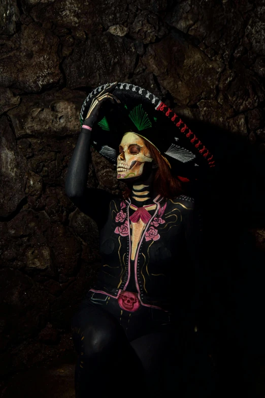 a woman in a skeleton makeup is posing for the camera