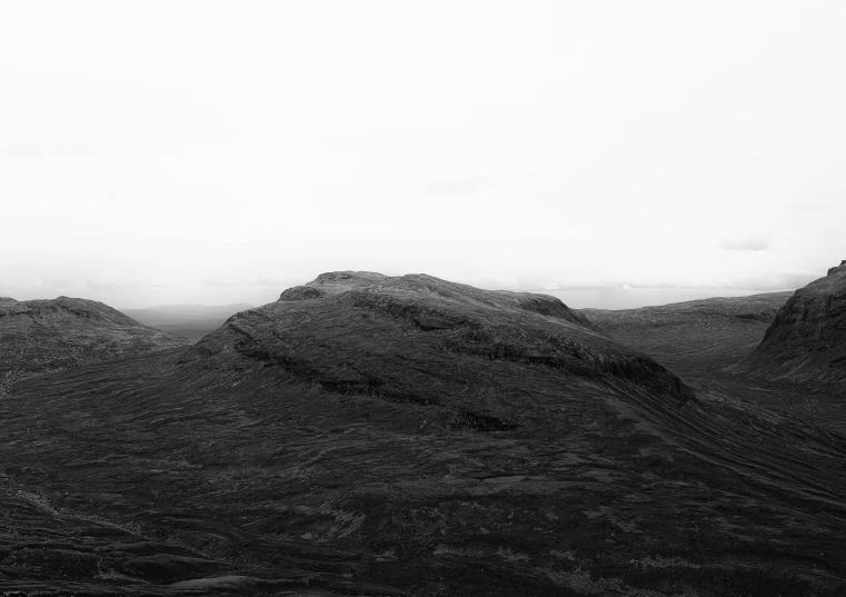 the mountains are all steep and black and white