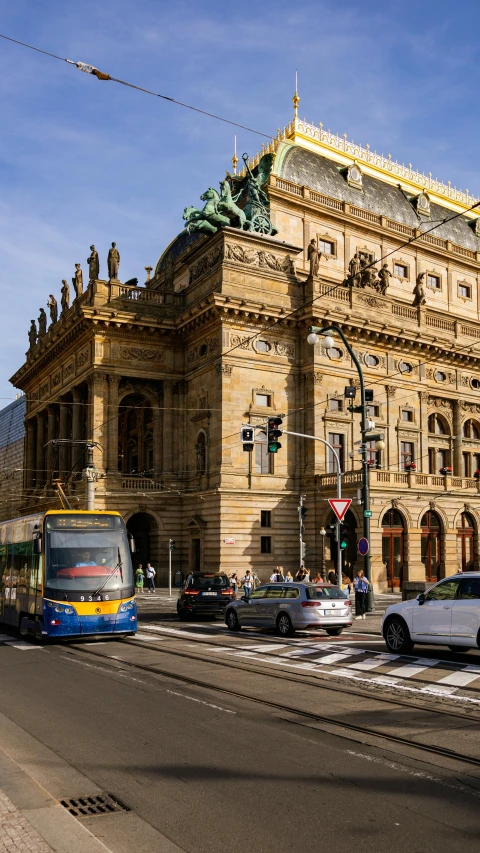 a busy city street with cars, buses and trams