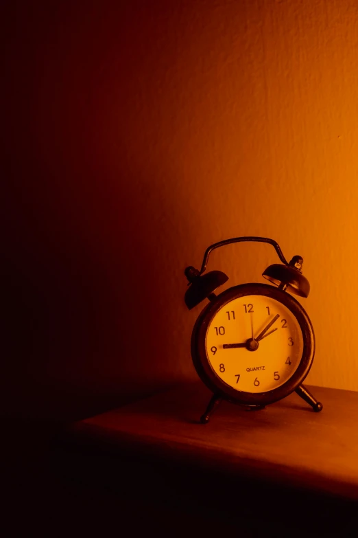 an antique clock is lit up against a bright wall