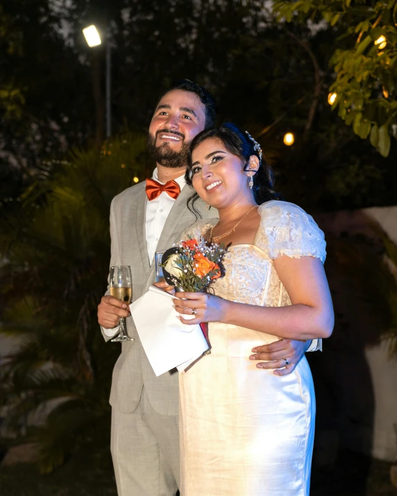 a woman and a man holding a bouquet