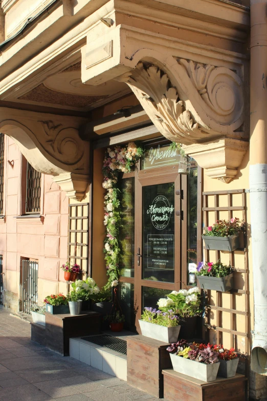 a floral shop sits on the corner of a building