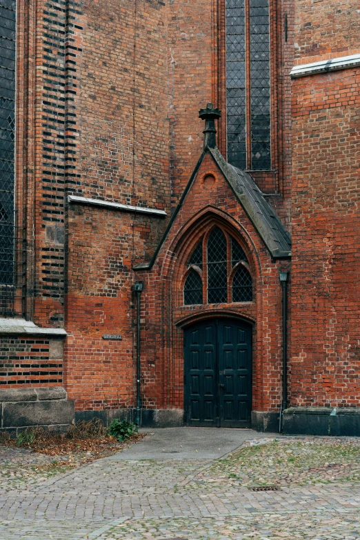 old brick church entrance with door and windows