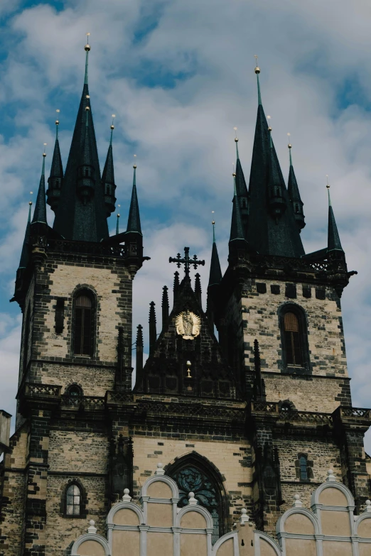 an old building with towers and a large clock