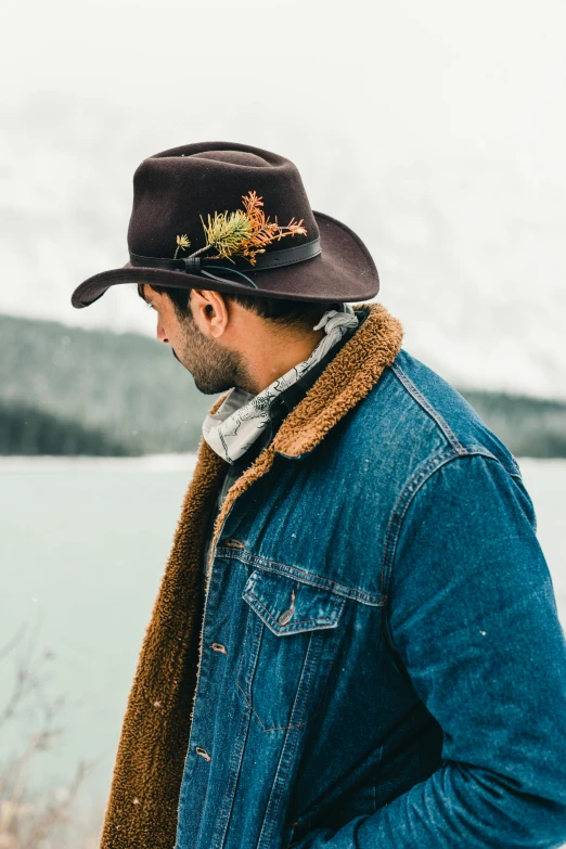 a man wearing a brown hat and a scarf