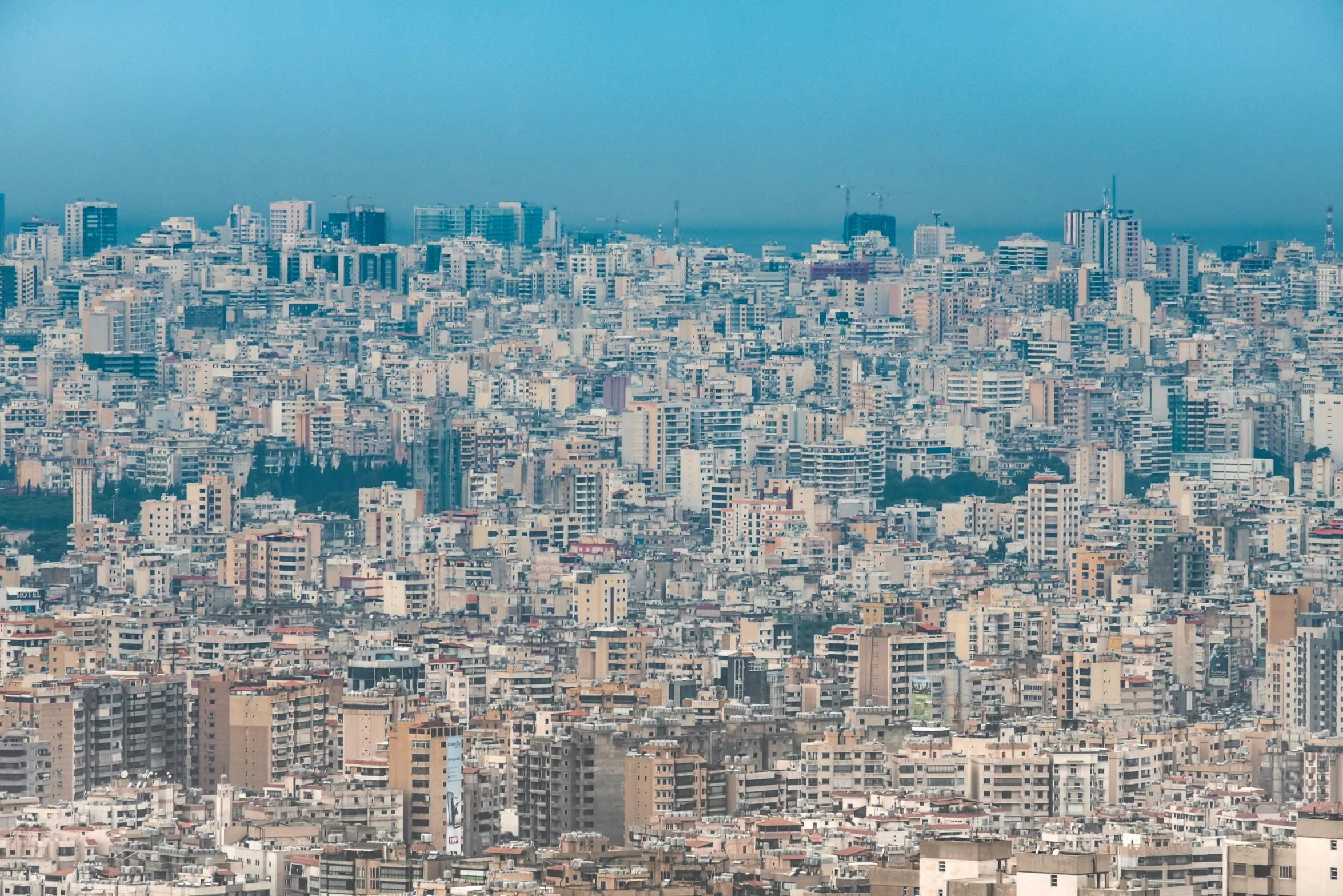 an aerial view of a city and large buildings