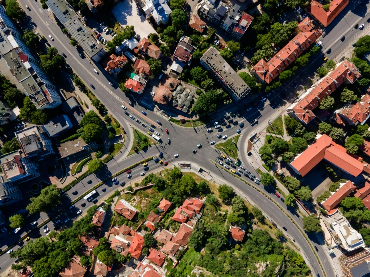 an aerial po of a city with a long road passing by