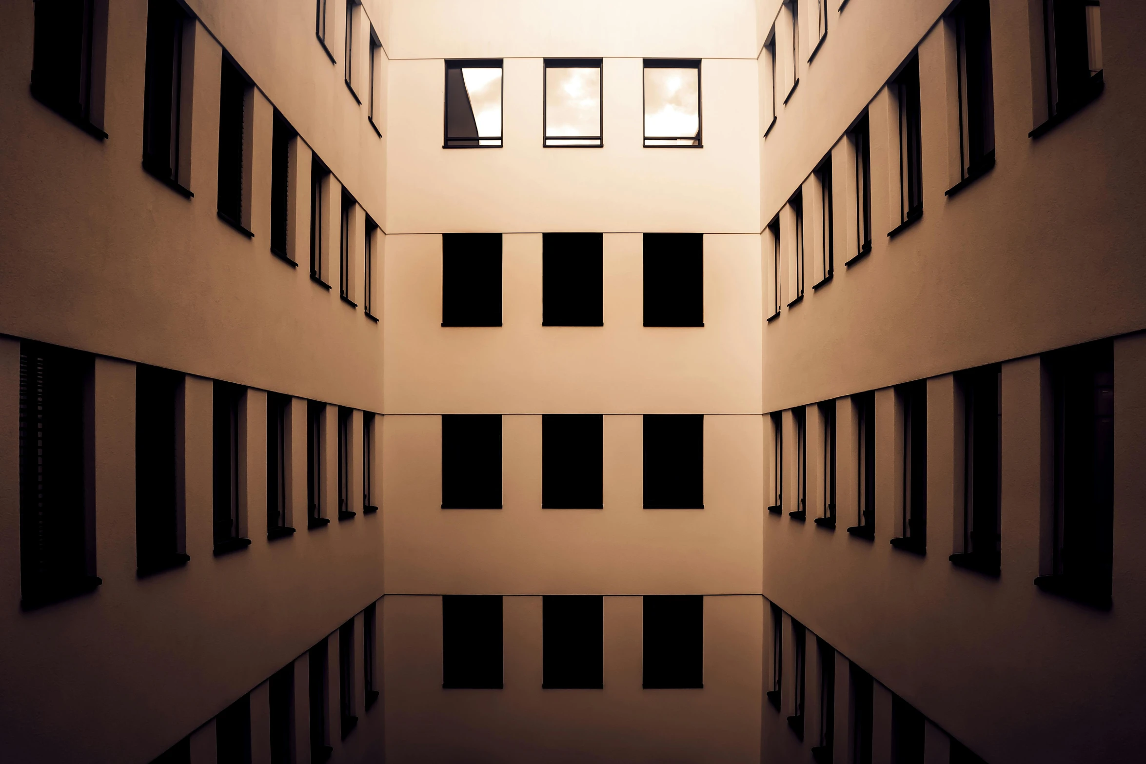 the interior of a building with tall windows