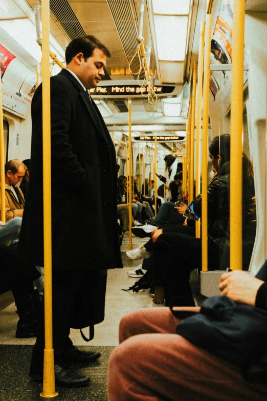 the man in the black suit is on the subway