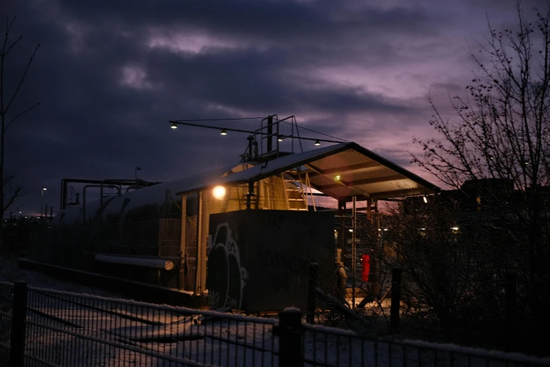 a night time po of a train on the tracks