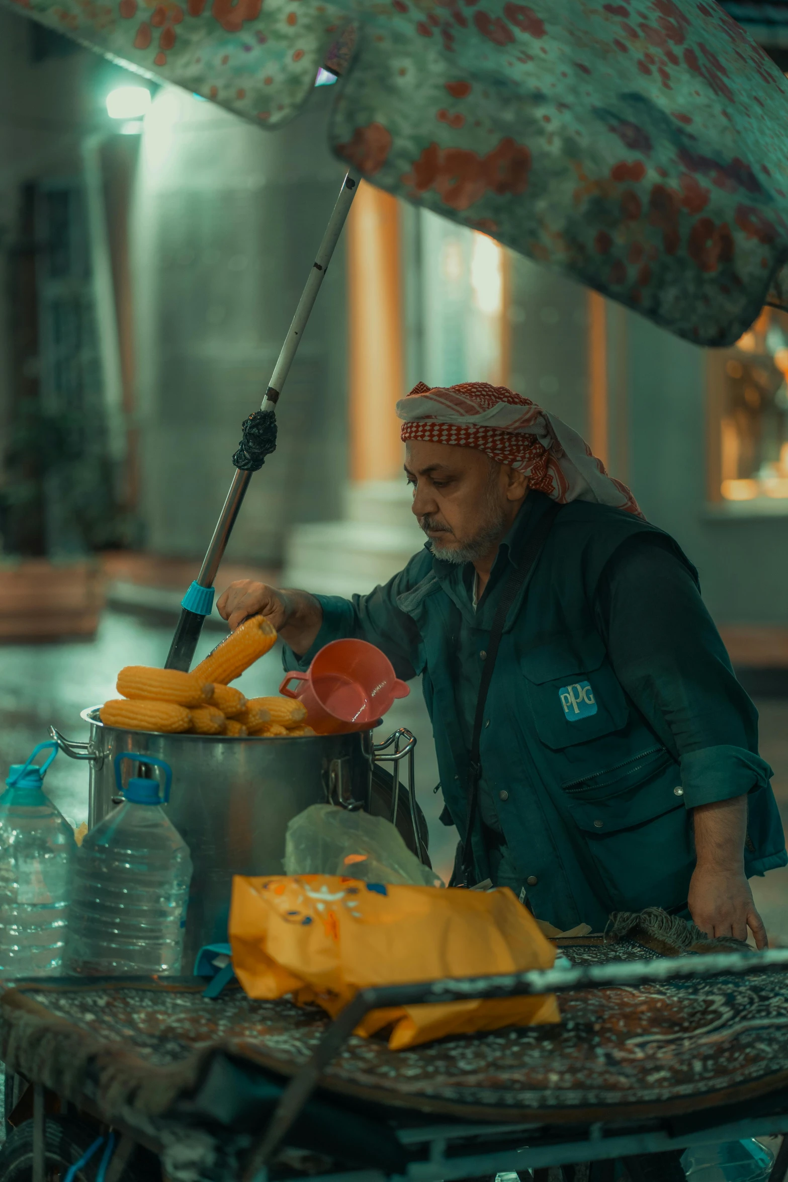 a man is at an outdoor stand with bananas