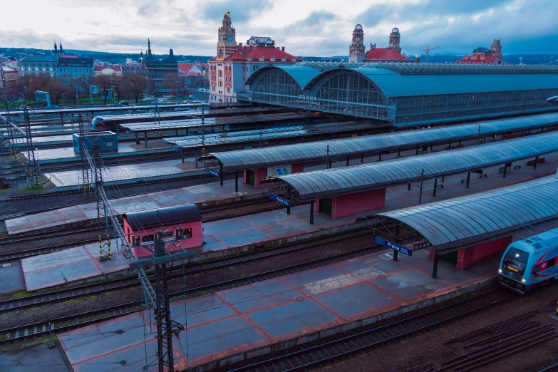 there are multiple trains parked near the train station