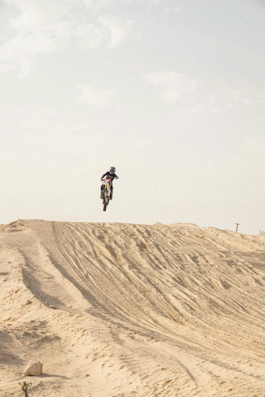 a man that is on a motorcycle jumping in the air