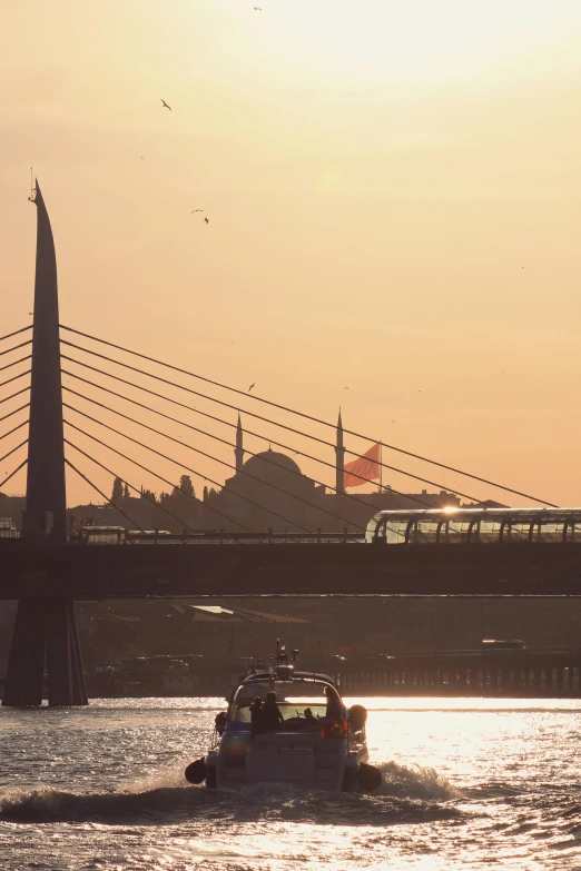 a train is going over a bridge in the evening