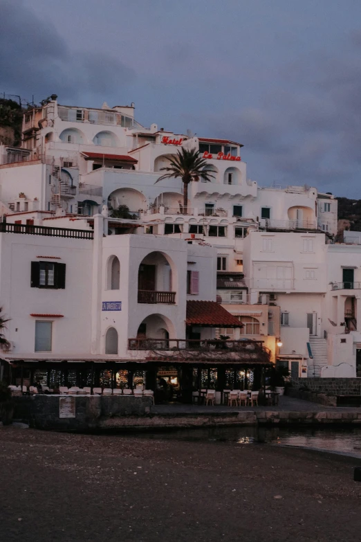 a bunch of white buildings and some palm trees