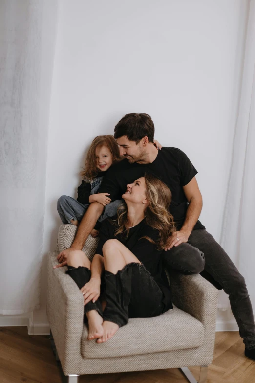 an image of a family sitting together on the couch