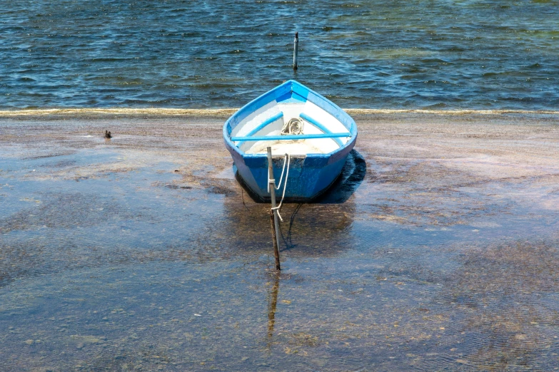 a boat that is sitting in some water